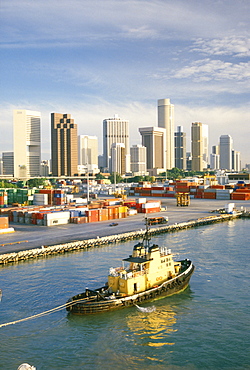 Containers on dockside and city skyline, Singapore, Southeast Asia, Asia