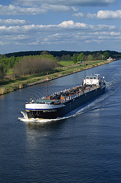 Barge transitting the Kiel Canal in Germany, Europe