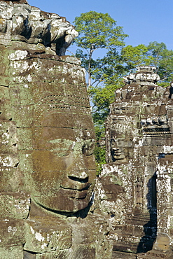 Myriad stone heads typifying Cambodia in the Bayon Temple, Angkor, Siem Reap, Cambodia