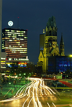 The Kaiser Wilhelm church and surrounding buildings illuminated at night on the Kurfurstendam in Berlin, Germany, Europe