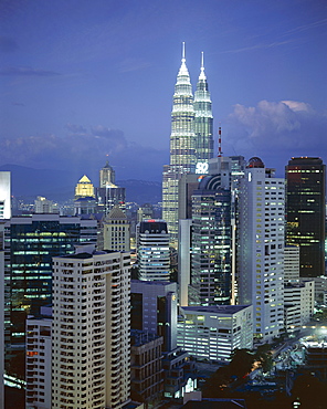 City skyline in the evening, with the twin towers of the Petronas Building, Kuala Lumpur, Malaysia, Asia