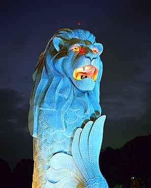 The Merlion statue, the symbol of Singapore, in turquoise light at night in Singapore, Southeast Asia, Asia