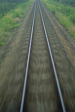 Railway tracks seen from a train at speed