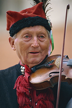 Musician in national dress, Krakow, Poland, Europe