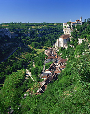 The town and church overlook a green valley at Rocamadour, Lot, Midi Pyrenees, France, Europe