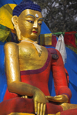 Buddha image at base of stupa, Swayambunath Stupa (Monkey Temple), UNESCO World Heritage Site, Kathmandu, Nepal, Asia