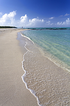 Idyllic beach scene with blue sky, aquamarine sea and soft sand, Ile Aux Cerfs, Mauritius, Indian Ocean, Africa