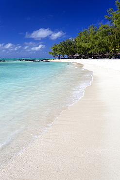 Idyllic beach scene with blue sky, aquamarine sea and soft sand, Ile Aux Cerfs, Mauritius, Indian Ocean, Africa