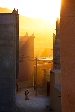 Golden sunlight shining through the streets just before sunset in the town of Nkob, near the Jbel Sarhro mountains, Morocco, North Africa, Africa