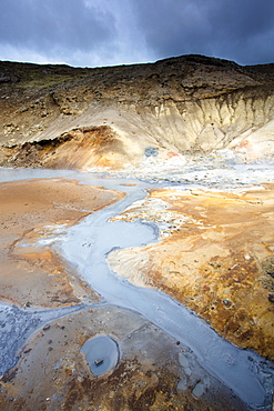 Boiling mud pools and stream at Seltun, part of the Krysuvik goethermal area on the Reykjanes Peninsula, Iceland, Polar Regions