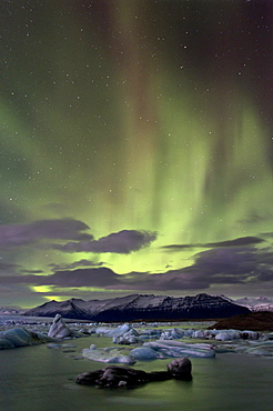 The Aurora Borealis (Northern Lights) captured in the night sky over Jokulsarlon glacial lagoon on the edge of the Vatnajokull National Park, during winter, South Iceland, Iceland, Polar Regions