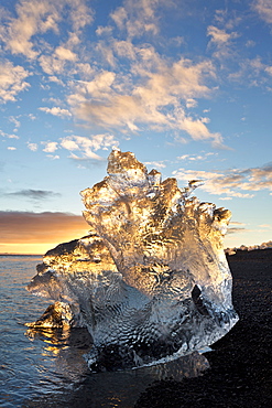 Icebergs at sunset on Jokulsa Beach, on the edge of the Vatnajokull National Park, South Iceland, Iceland, Polar Regions