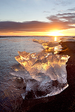 Icebergs at sunset on Jokulsa Beach, on the edge of the Vatnajokull National Park, South Iceland, Iceland, Polar Regions