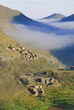 Mist rising above a village in the High Atlas mountains, Morocco, North Africa, Africa