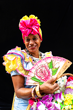 Colourful flower girl with headdress, fan and basket, Havana, Cuba (Model Release) 2