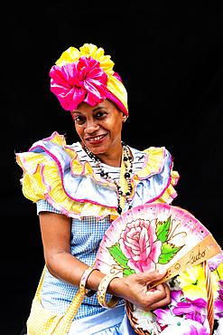 Colourful flower girl with headdress, fan and basket, Havana, Cuba (Model Release) 1