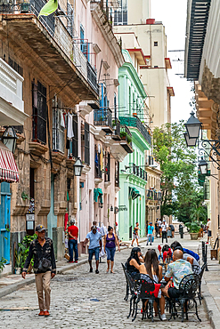 Typical street scene, cafe tables spilling out onto the street, Old Havana, Cuba