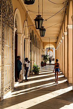 Sunlight streams through a colonnade, Cienfuegos, Cuba