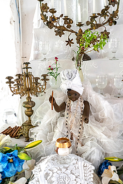 Black doll, cigars and shrine at Santeria Temple (Afro-Cuban religion), Trinidad, Cuba