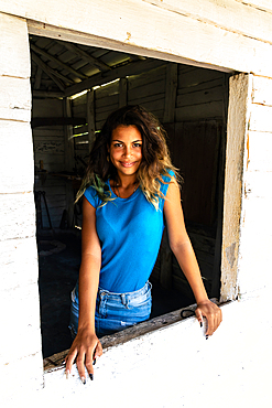 Textile seller at her shop window, Valle de los Ingenios, near Trinidad, Cuba 4 (Model Release)