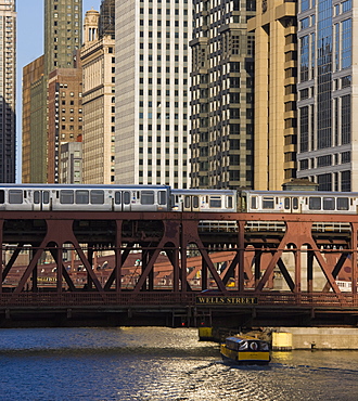 An El train on the Elevated train system crossing Wells Street Bridge, Chicago, Illinois, United States of America, North America