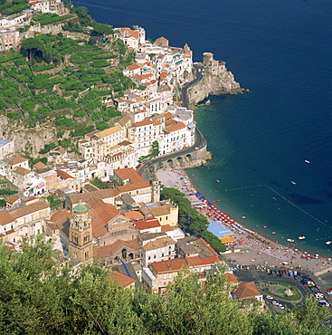 Low aerial view over the town and beach at Amalfi on the coast, Costiera Amalfitana, UNESCO World Heritage Site, Campania, Italy, Europe