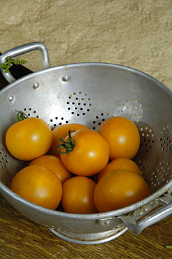 Tomatoes in colander ready for washing