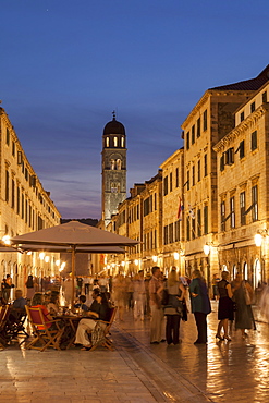 People strolling and cafes, Placa lit up at dusk, Dubrovnik, Croatia, Europe 