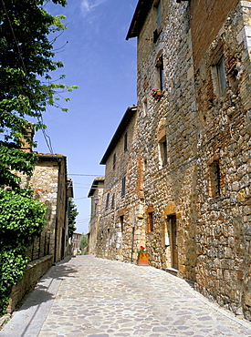 View along Via Matteotti with the oldest building in the best preserved fortified medieval village in Tuscany, Monteriggioni, Siena, Tuscany, Italy, Europe