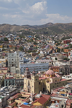 The Basilica de Nuestra Senora de Guanajuato, the yellow building in the foreground, with the blue grey building of the University of Guanajuato behind, Guanajuato, a UNESCO World Heritage Site, Guanajuato State, Mexico, North America