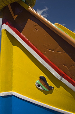 Close-up of a brightly coloured fishing boat (Luzzus) with the eye of Osiris to ward off evil at Marsaxlokk, a fishing village, Malta, Europe