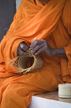 Monk making basket, Laos, Indochina, Southeast Asia, Asia