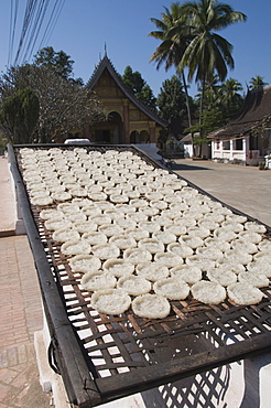 Drying rice cakes for monks, Luang Prabang, Laos, Indochina, Southeast Asia, Asia