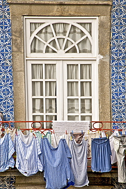 Laundry hanging from window in the Ribeira Quarter, Oporto, Portugal, Europe