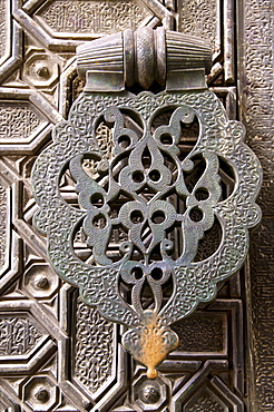 Bronze knocker on wooden engraved doors, Reales Alcazares, Seville, Andalucia, Spain, Europe