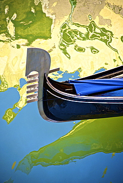 Gondola among reflections on a canal, Venice, UNESCO World Heritage Site, Veneto, Italy, Europe