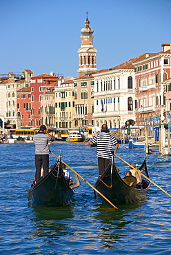 Gondolas and gondoliers, palaces facades and church steeple, Grand Canal, Venice, UNESCO World Heritage Site, Veneto, Italy, Europe