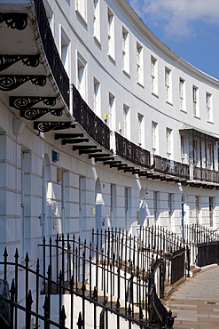 Terrace of Regency style Georgian houses with wrought iron balconies on The Royal Crescent, Cheltenham Spa, Gloucestershire, England, United Kingdom, Europe