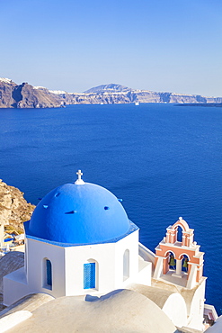 Greek church with blue dome and pink bell tower, Oia, Santorini (Thira), Cyclades Islands, Greek Islands, Greece, Europe