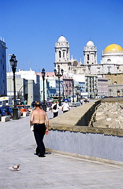 Spain, Andaloucia, Cadiz, Bare-Chested Man Walking On The Water Front