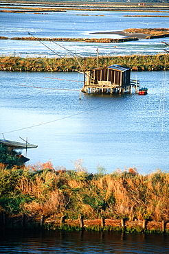 Italy, Emilia Romagna, River Po Delta, Comarchio, The Swamps, Huts And Nets Of The Eels Catchers