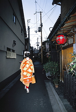 Japan, Kyoto, Geisha In A Gion Street At Dusk