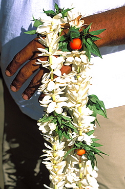 Man holding flowers,Tahiti, French polynesia