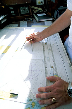 Crew member with navigation chart, cruise ship, Southeast Asia, Asia