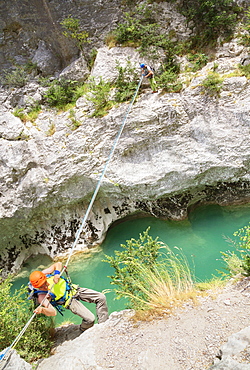 Man crossing the Verdon River on a rope, Provence-Alpes-Cote d'Azur, Provence, France, Europe