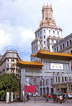 Gate to Barrio Chino (Chinatown) with the original headquarters of the Compan?a Cubana de Telefonos dating from 1927, in the background, Central Havana, Cuba, West Indies, Central America