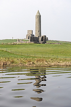 The Round Tower, 27m tall, used as belfry to call monks to prayer and to summon travellers at Devenish, a monastic settlement with a history from the 6th to the 16th century, Devenish Island, Lough (lake) Erne, Enniskillen, County Fermanagh, Ulster, Northern Ireland, United Kingdom, Europe