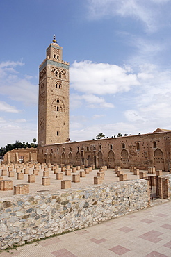 The Koutoubia minaret rises up from the heart of the old medina next to a mosque of the same name, Marrakesh. Morocco, North Africa, Africa