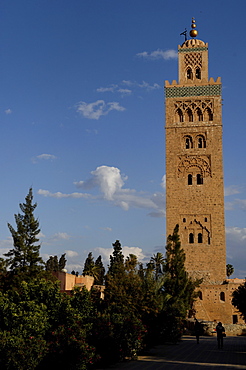 The Koutoubia minaret rises up from the heart of the old medina next to a mosque of the same name, Marrakesh. Morocco, North Africa, Africa