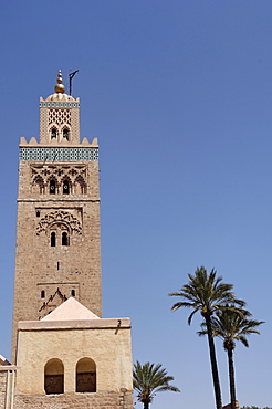 The Koutoubia minaret rises up from the heart of the old medina next to a mosque of the same name, Marrakesh. Morocco, North Africa, Africa